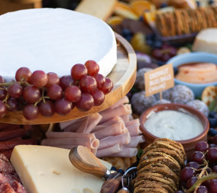 meats, cheeses, and fruits with crackers